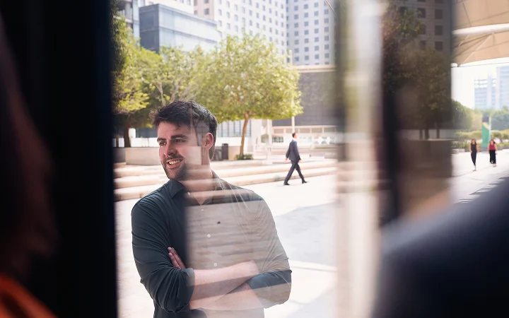 man through window in the city