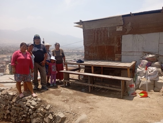 A group of people standing outside a buildingAI-generated content may be incorrect.