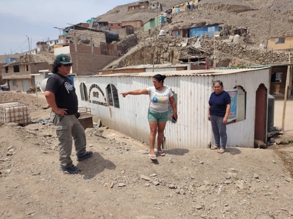 A group of people standing in a dirt areaAI-generated content may be incorrect.