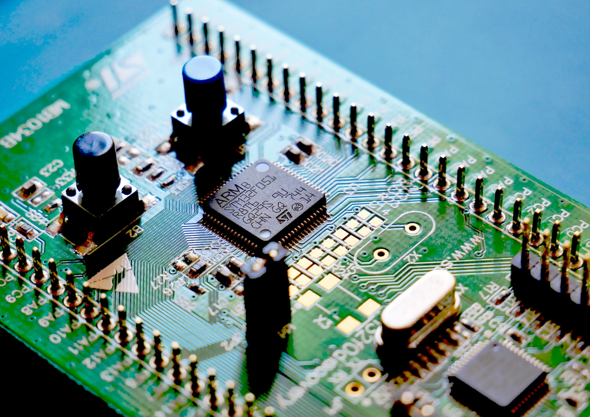 A close-up of a microcontroller development board with a connected Arm CPU. 