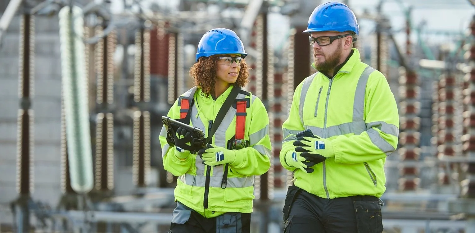 man in hi-vis on phone in warehouse