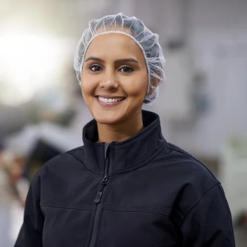 Candidate Attraction image Assembly operative wearing a hairnet