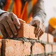 man laying bricks