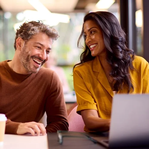 Business person sat at a laptop