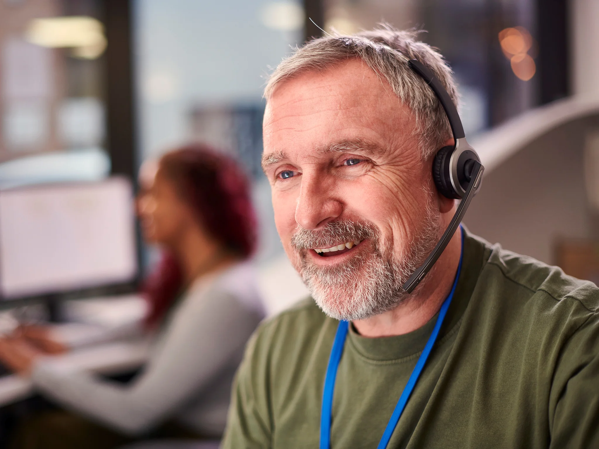 Smiling Customer Service Advisor wearing a headset