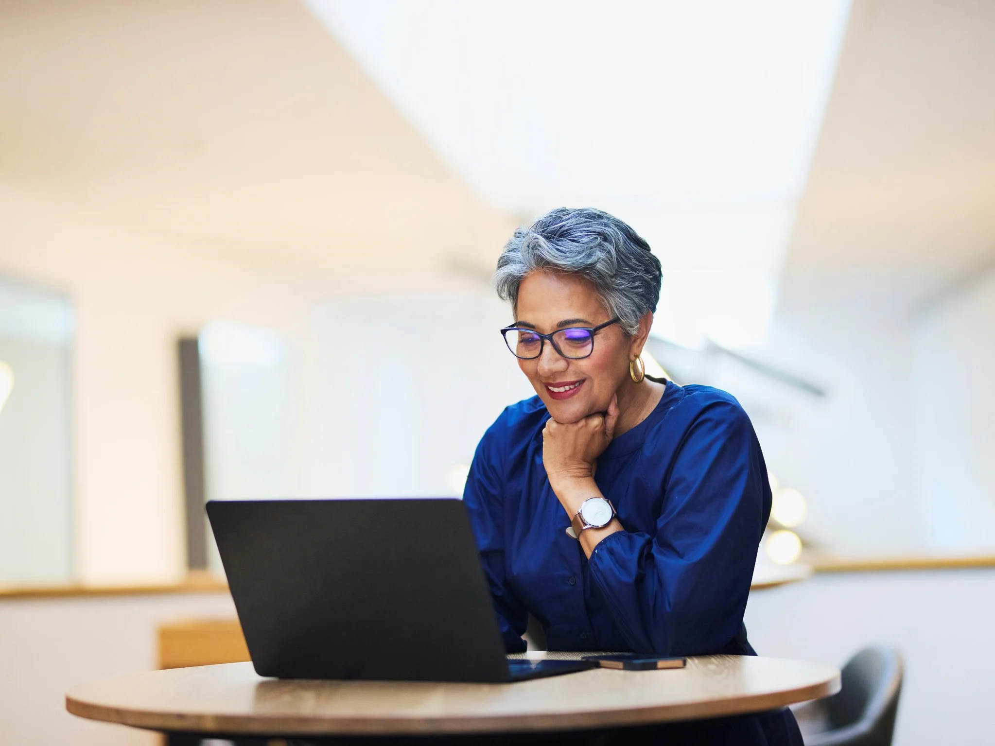 A mature woman working in an office