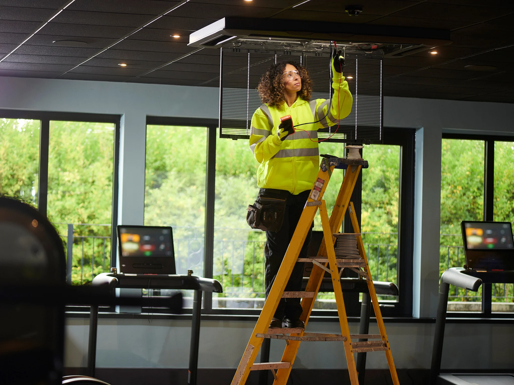 Electrical Engineer installing aircon