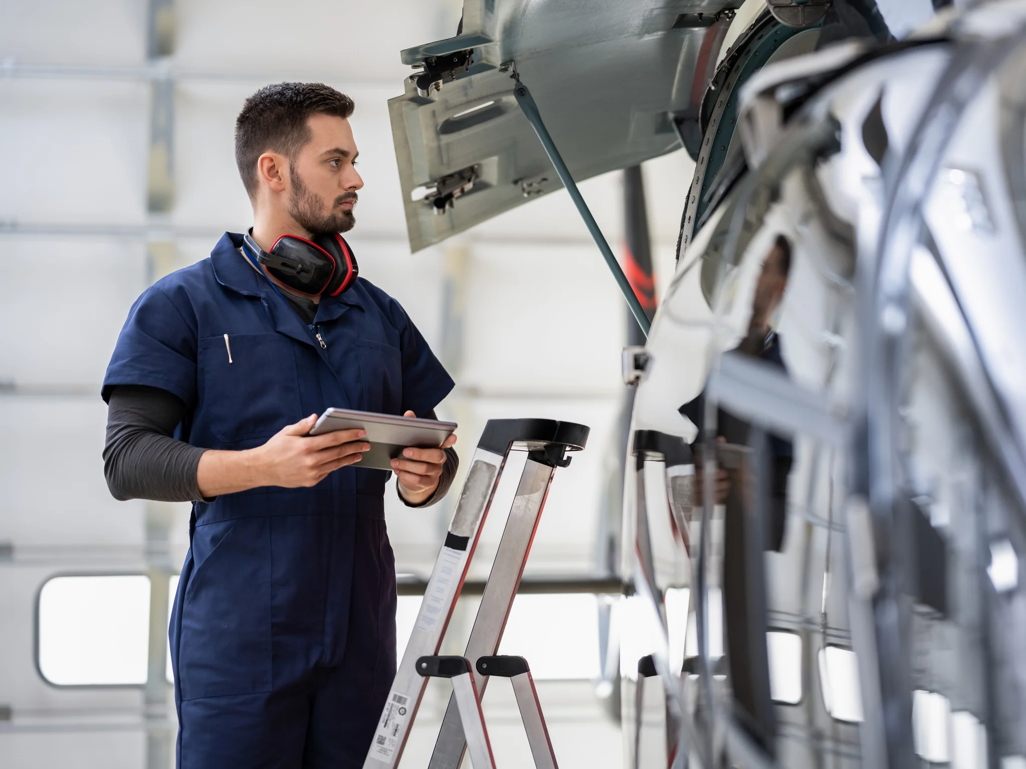 aircraft maintenance technician inspecting an airplane