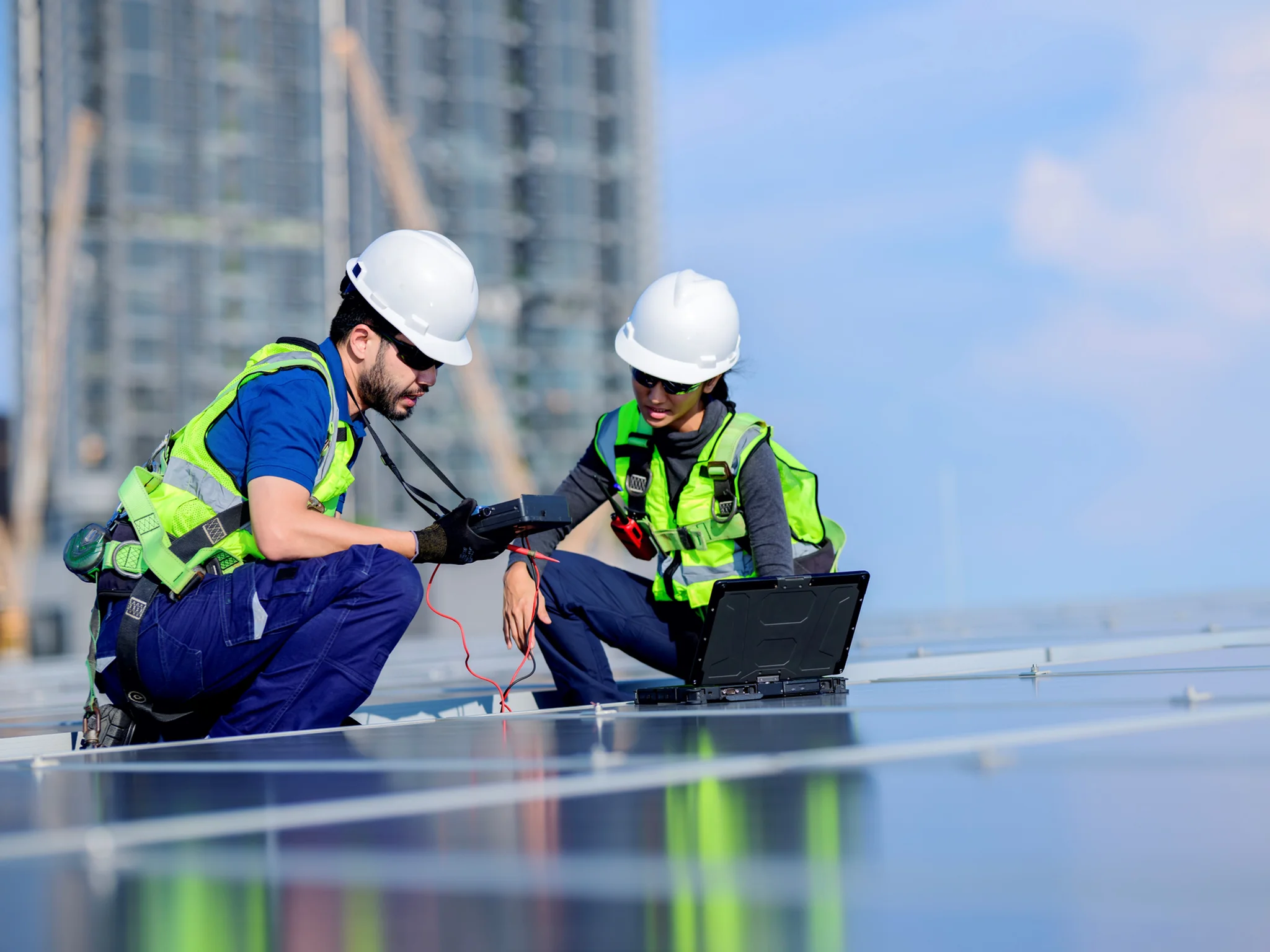 Two Engineers reviewing solar panels