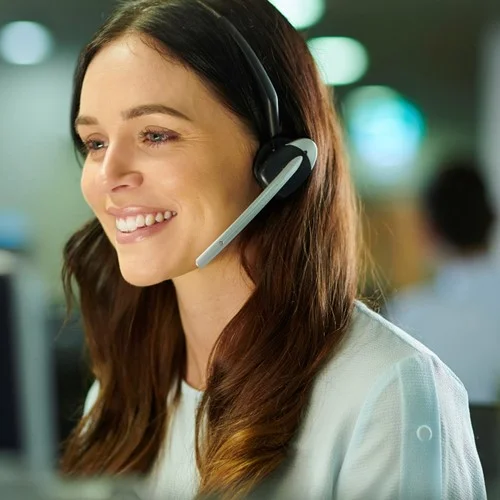 Contact Centre image A Customer Service Representative sat at a computer talking through a headset