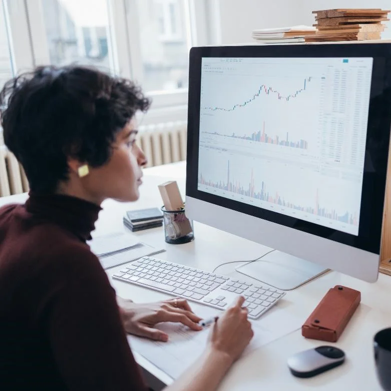 A Demand Planning Manager looking at data on their desktop