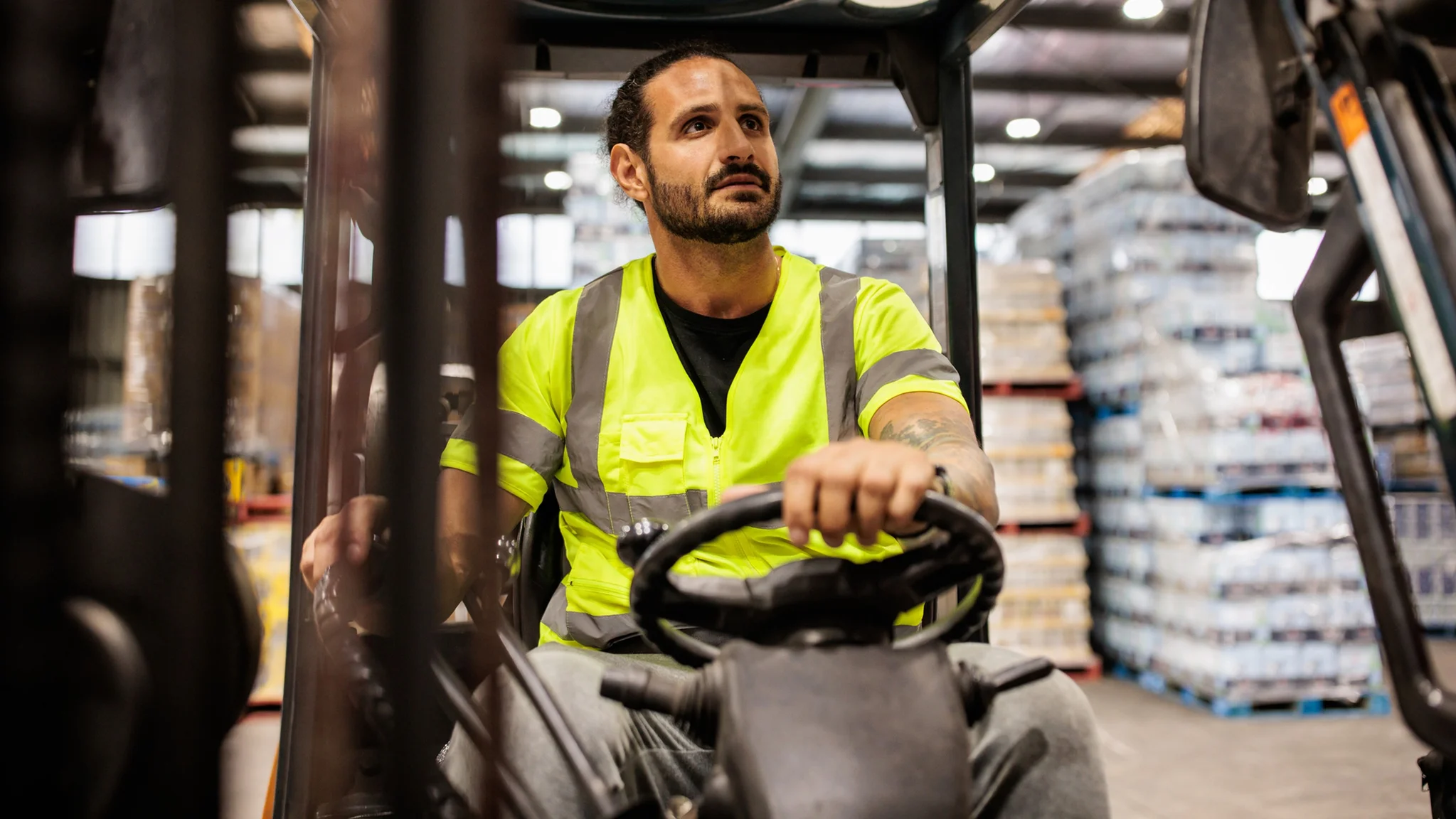 Forklift Truck Driver wearing yellow hi vis jacket