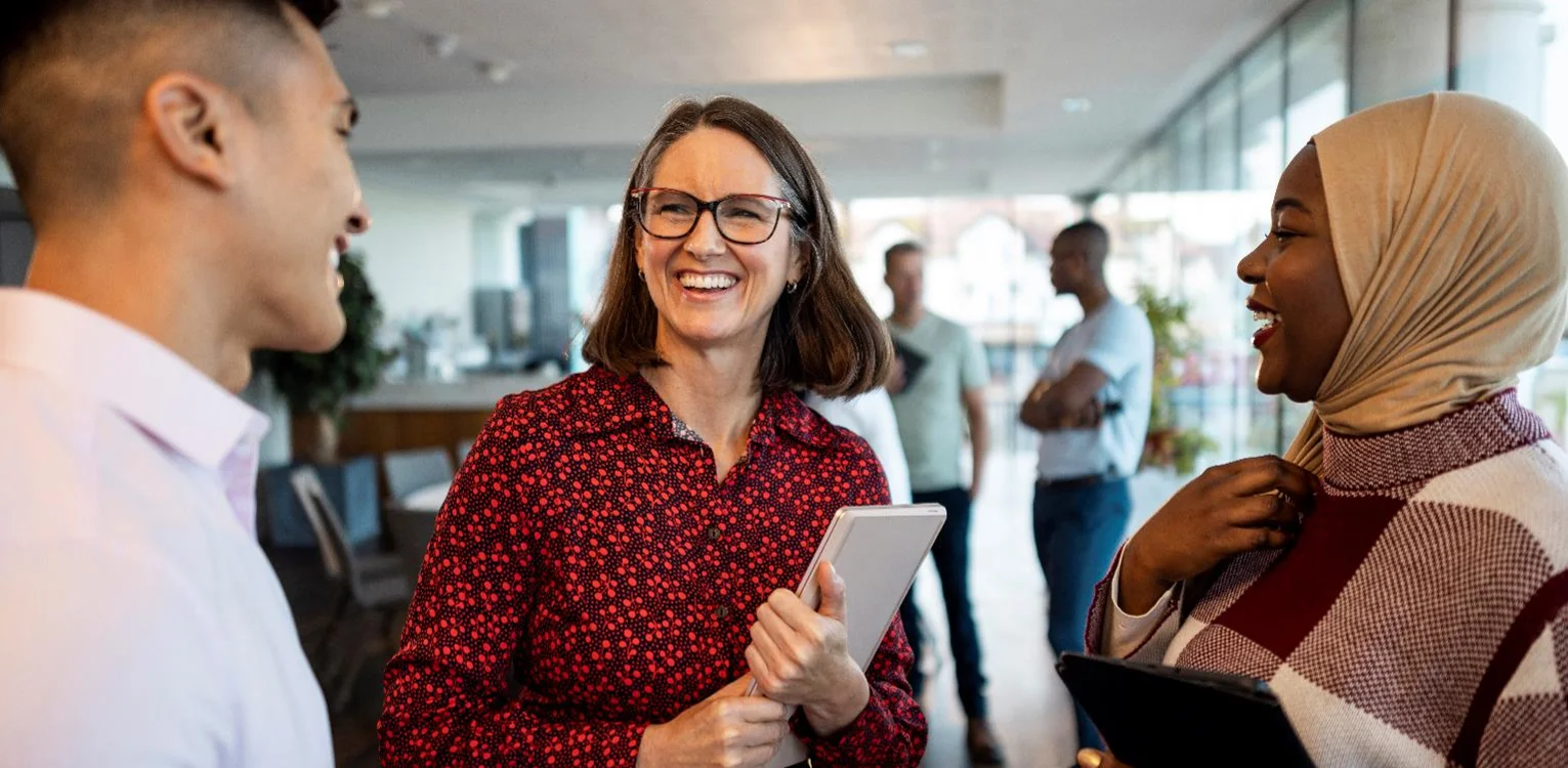woman smiling with ipad