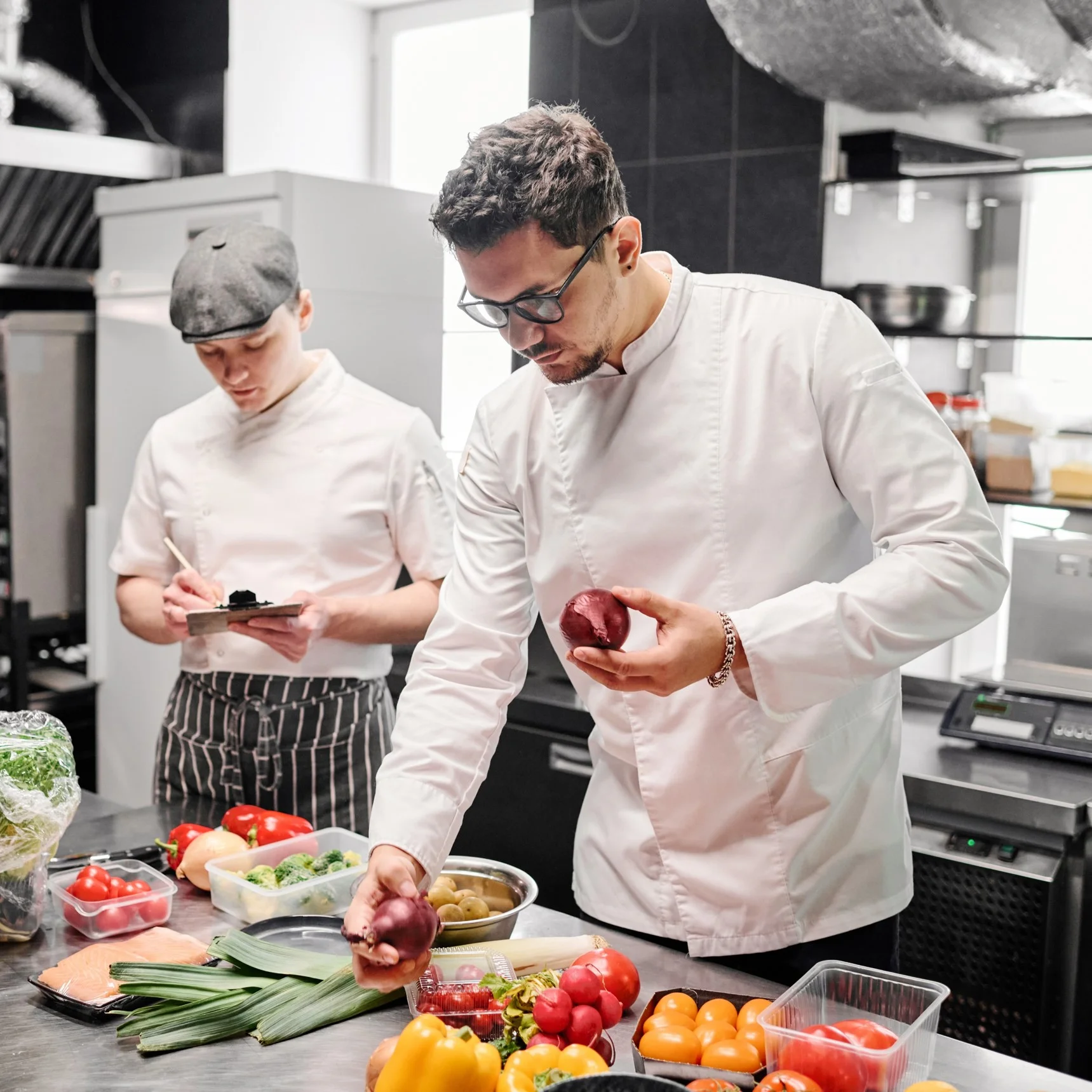 A Commis Chef working with a senior Chef