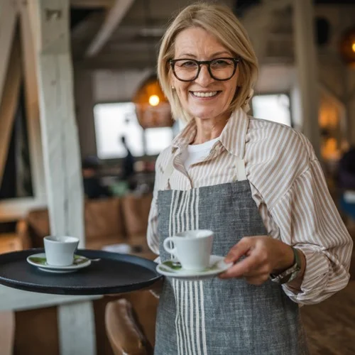 Temporary Recruitment image Waiting Staff holding a tray in one hand and a cup and saucer in the other