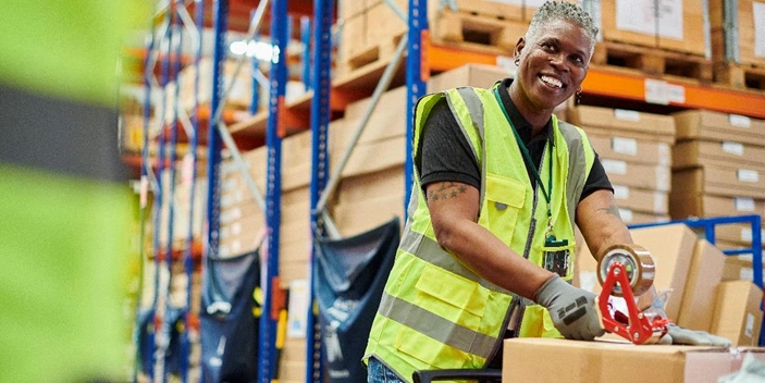 man packing boxes