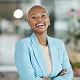 woman smiling in blue suit