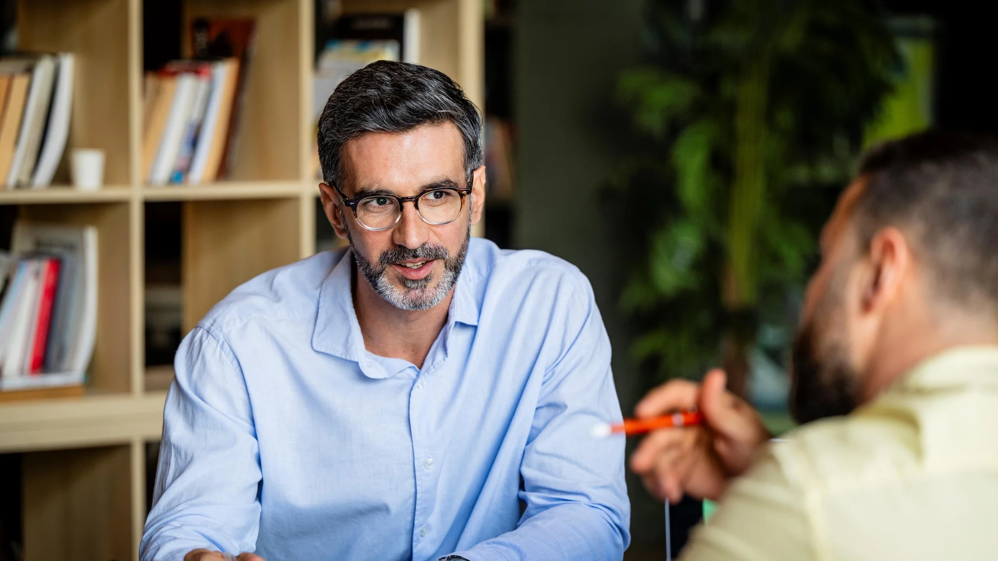 A recruitment consultant in discussion with an employer