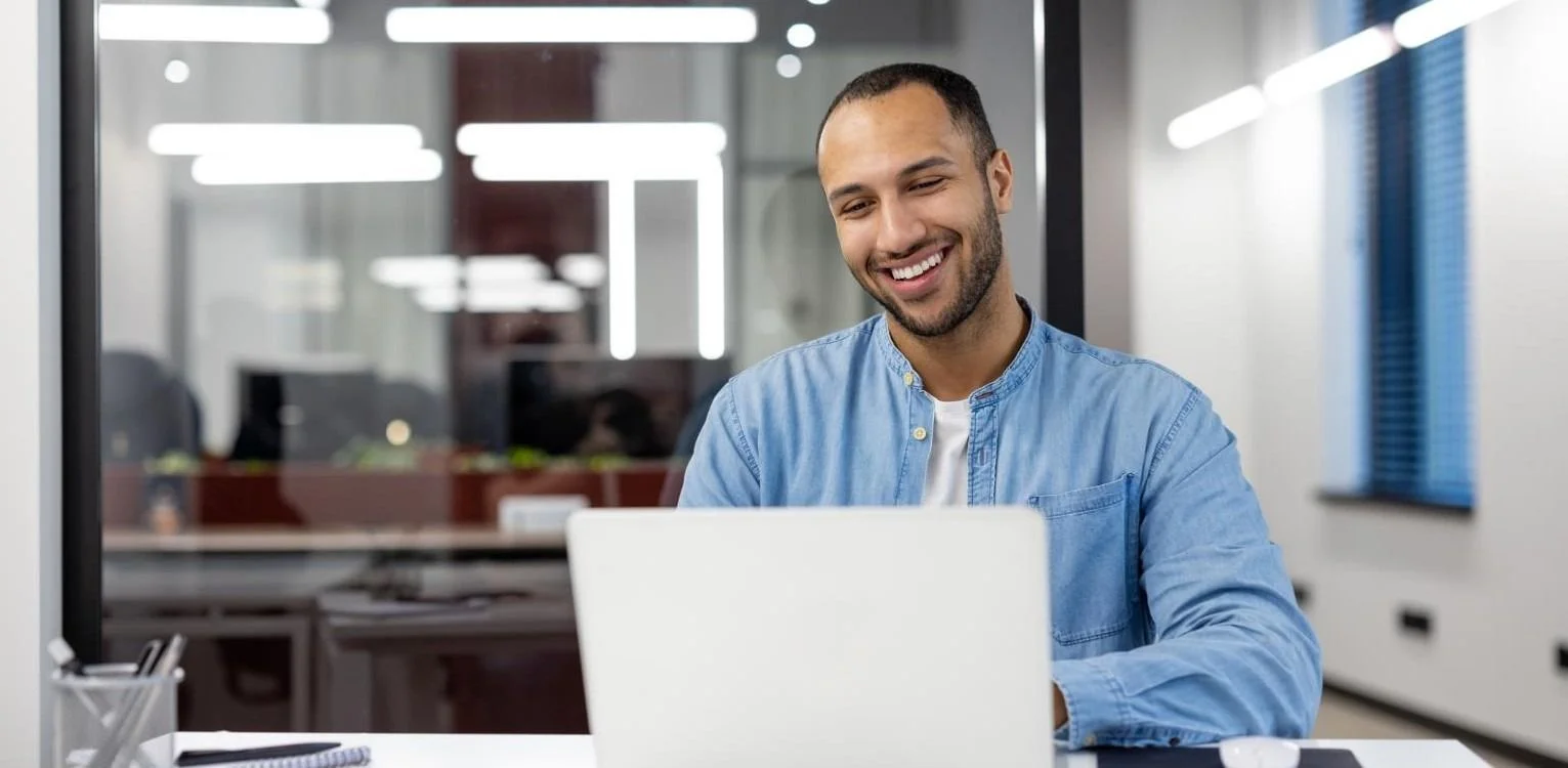 Information Technology & Technology image man on laptop smiling