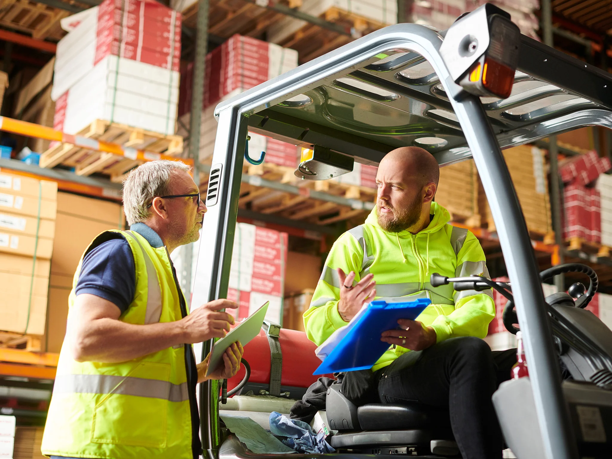Two Warehouse workers in discussion