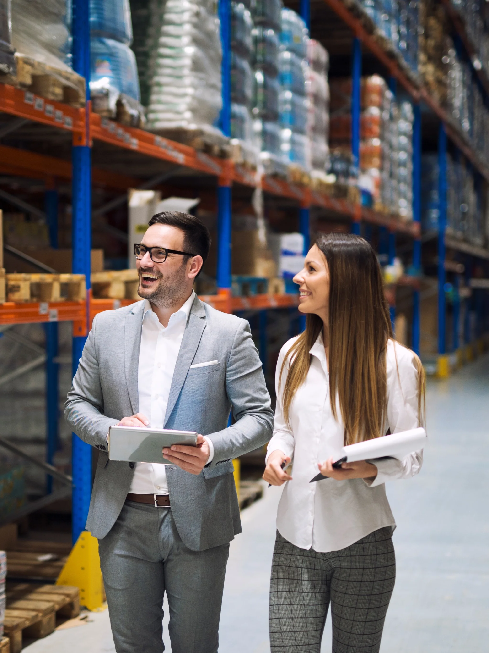 Logistics professionals reviewing warehouse operations in a distribution centre