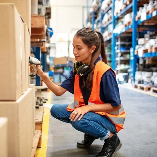 Warehouse worker scanning packages