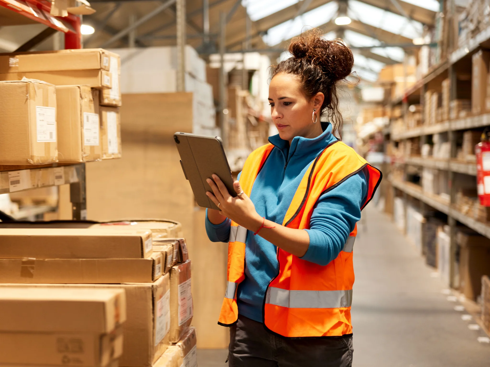 Warehouse worker checking parcels in a warehouse