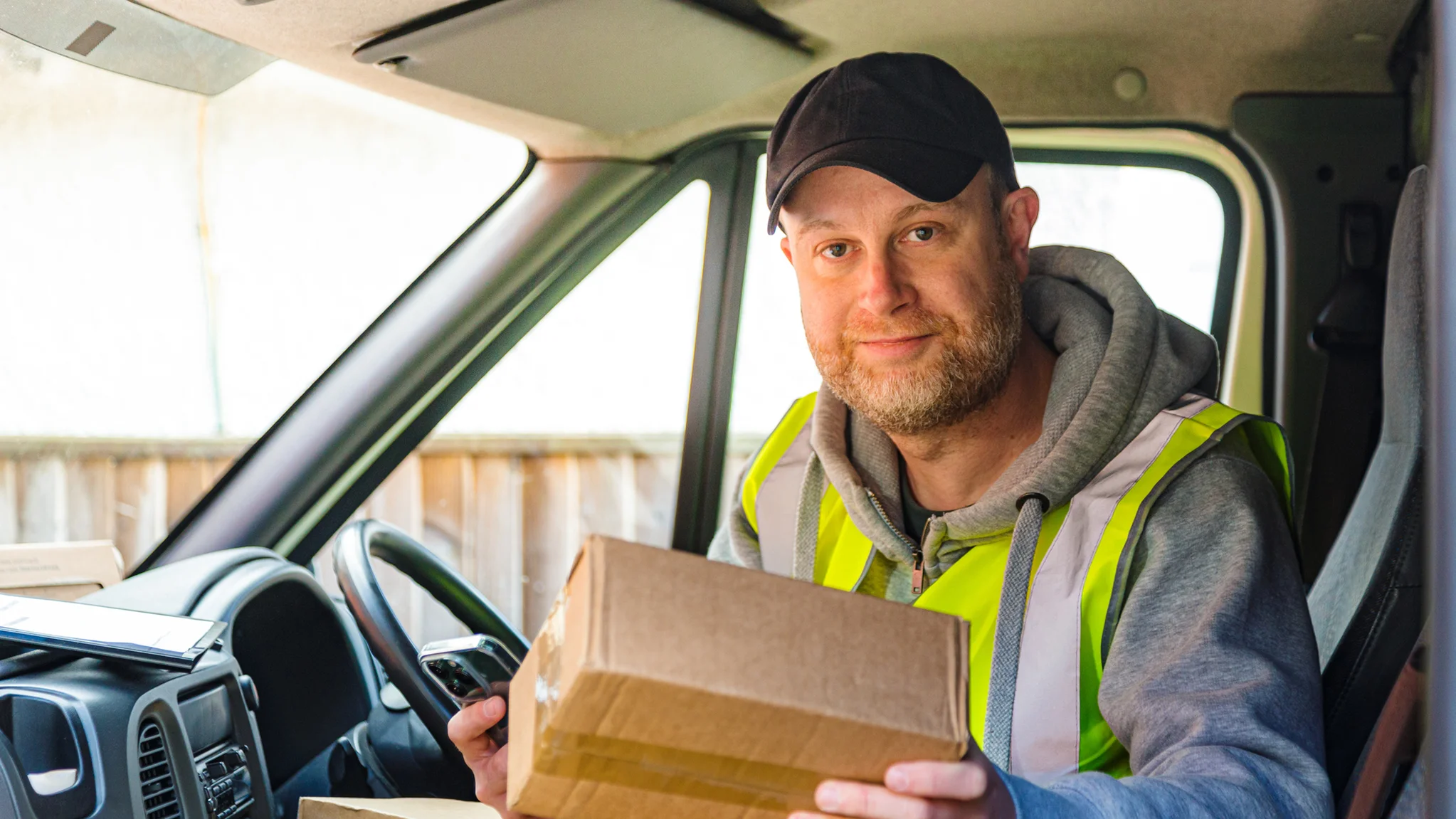 Delivery driver smiling ready to make a delivery
