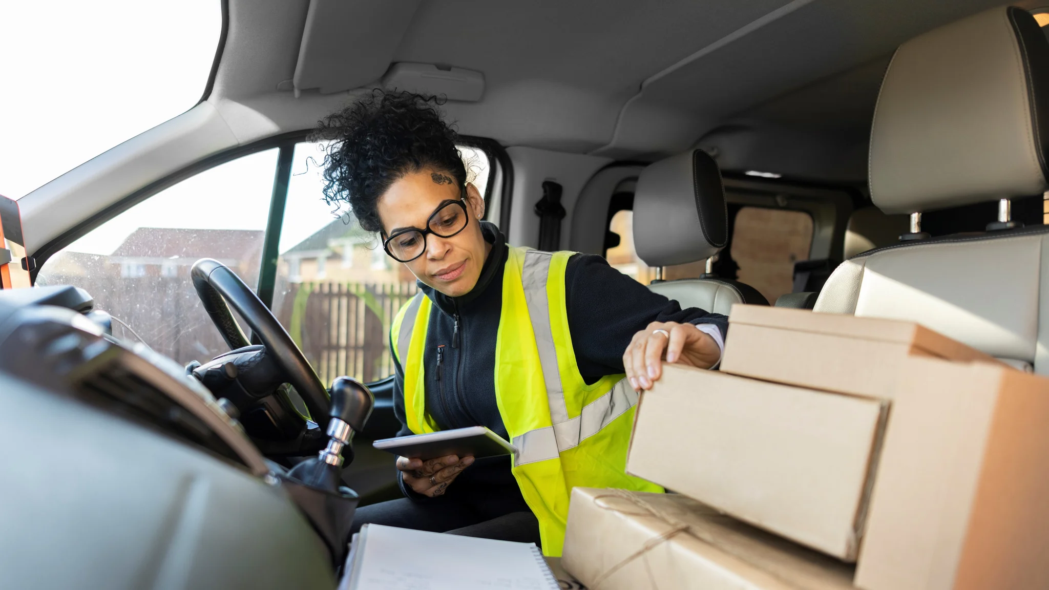 Delivery Driver checking parcels in a vehicle