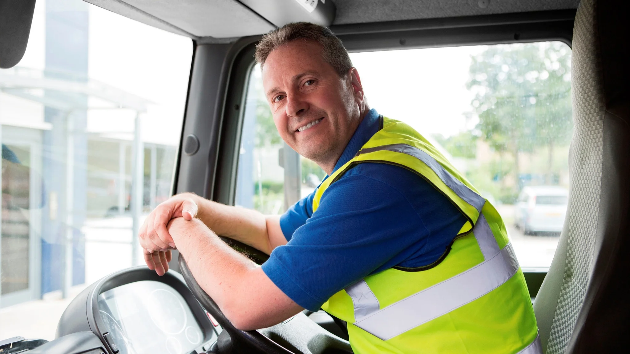 A HGV driver smiling 