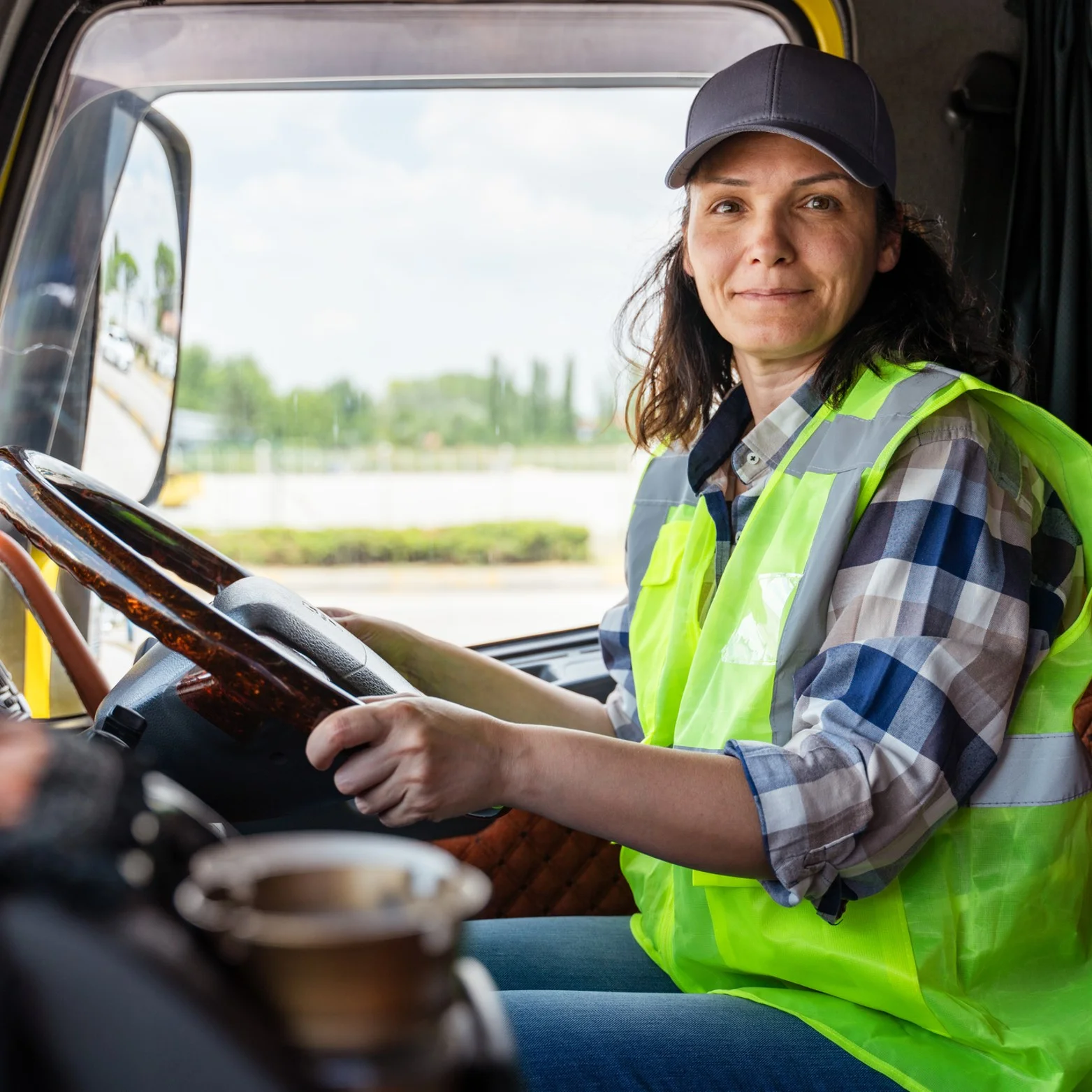 DPD image Smiling delivery driver in a vehicle cab