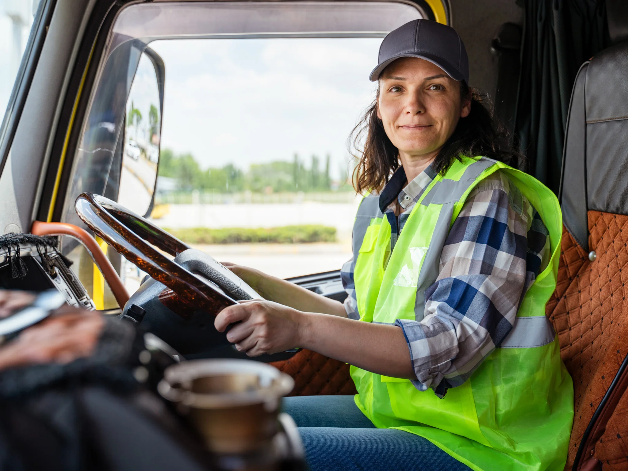 Smiling Delivery Driver inside vehicle cab