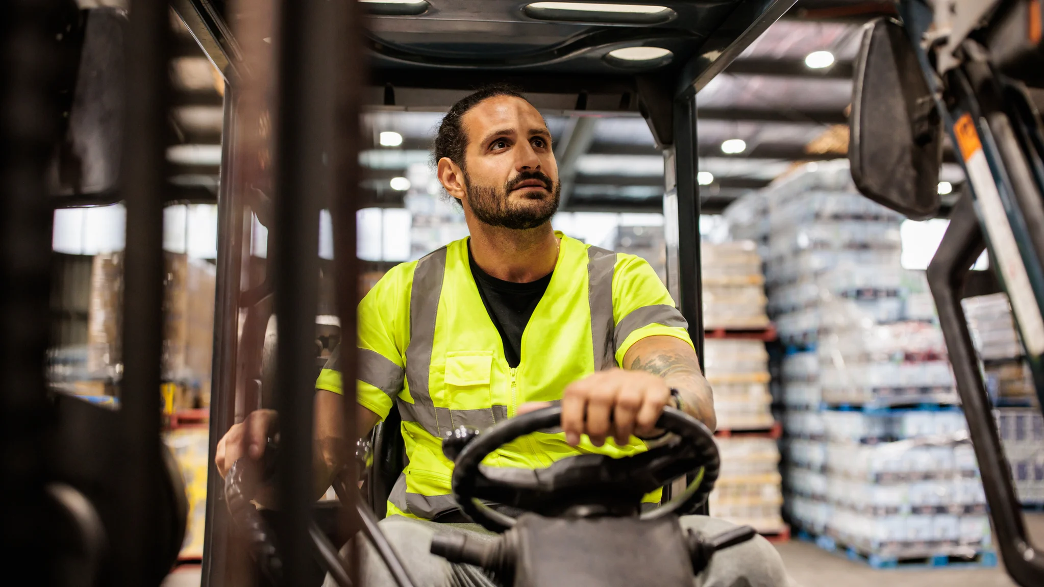 Warehouse worker operating a forklift