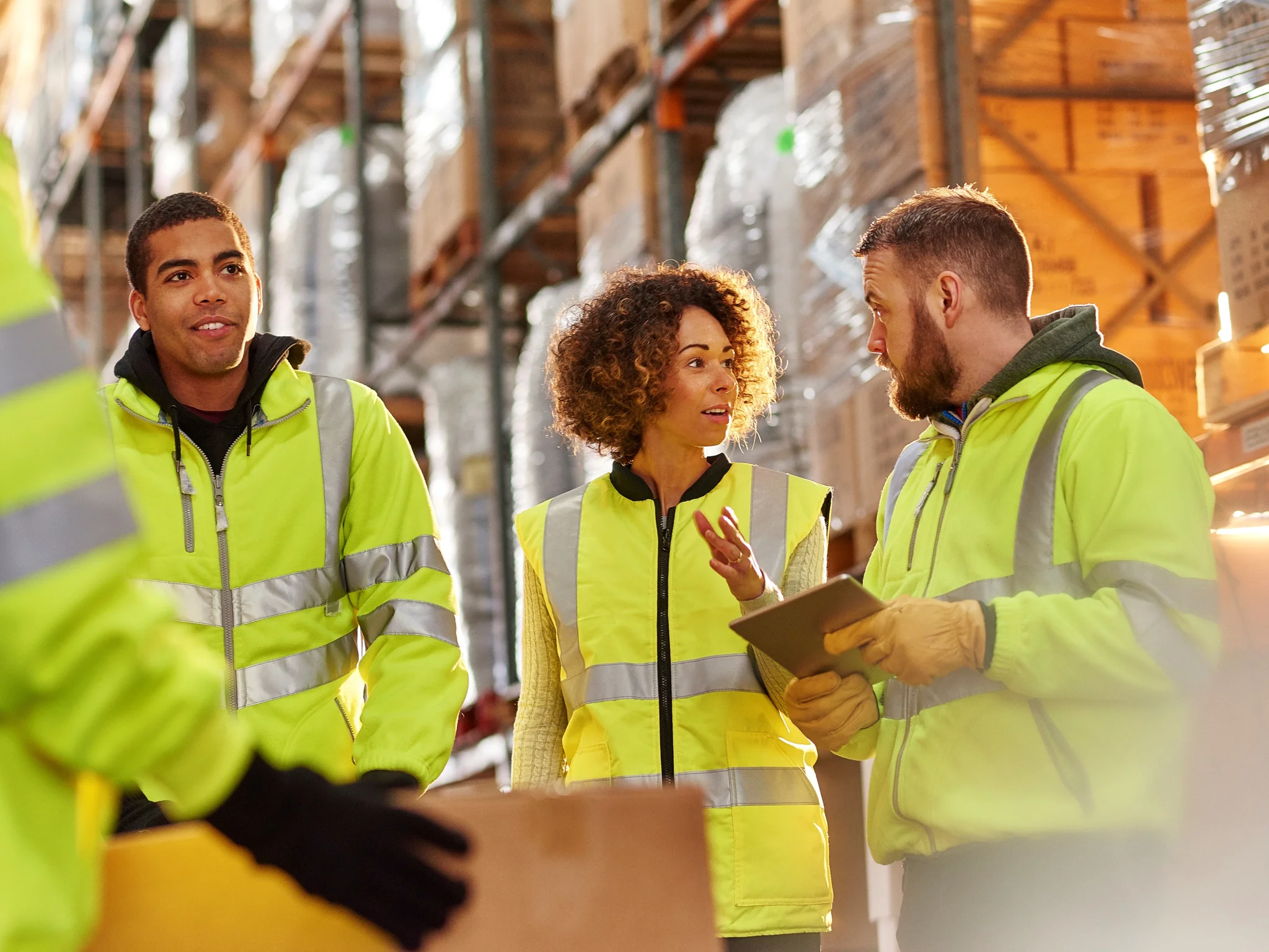 Warehouse workers engaged in discussion