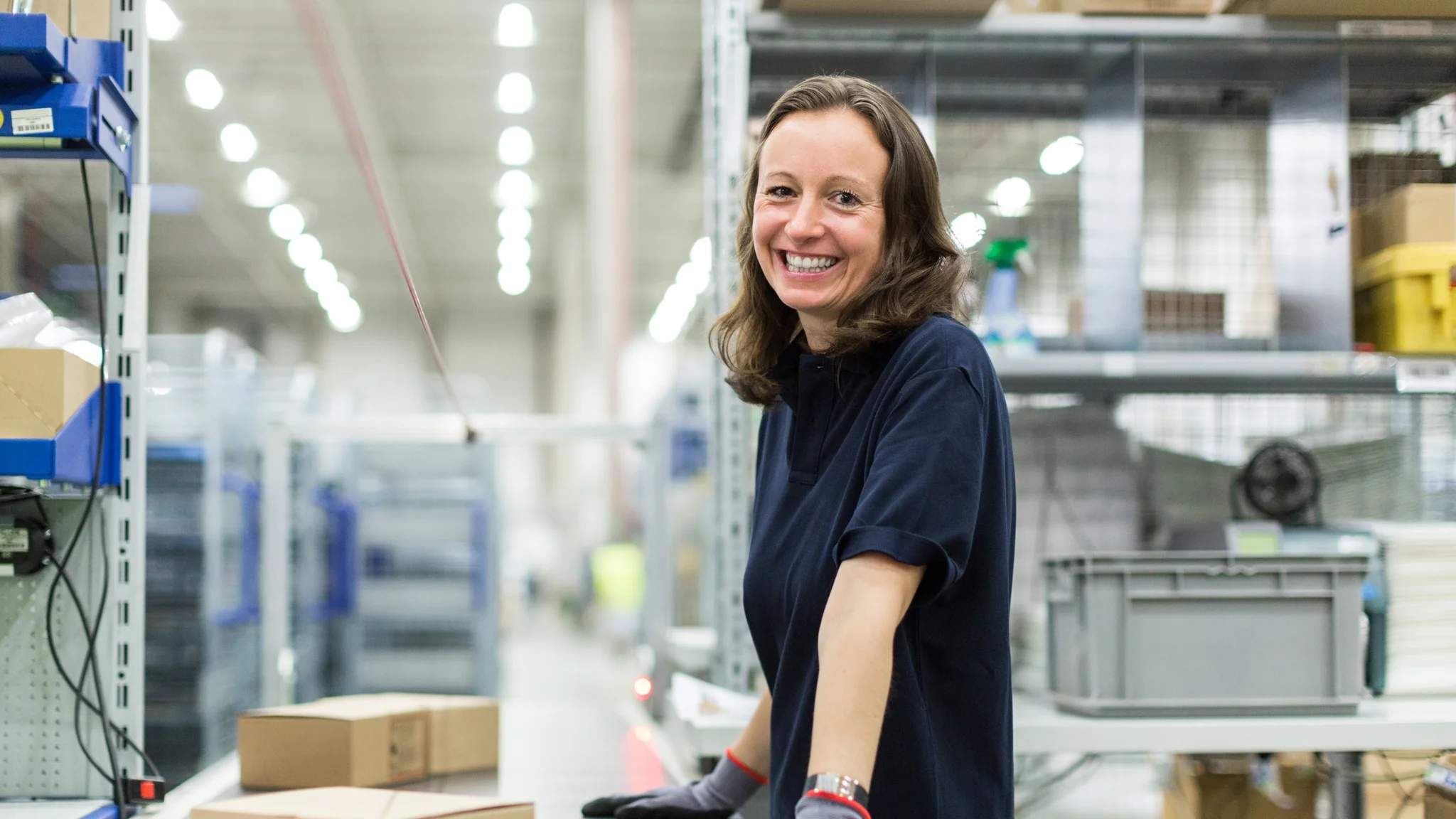 Smiling warehouse worker in a warehouse
