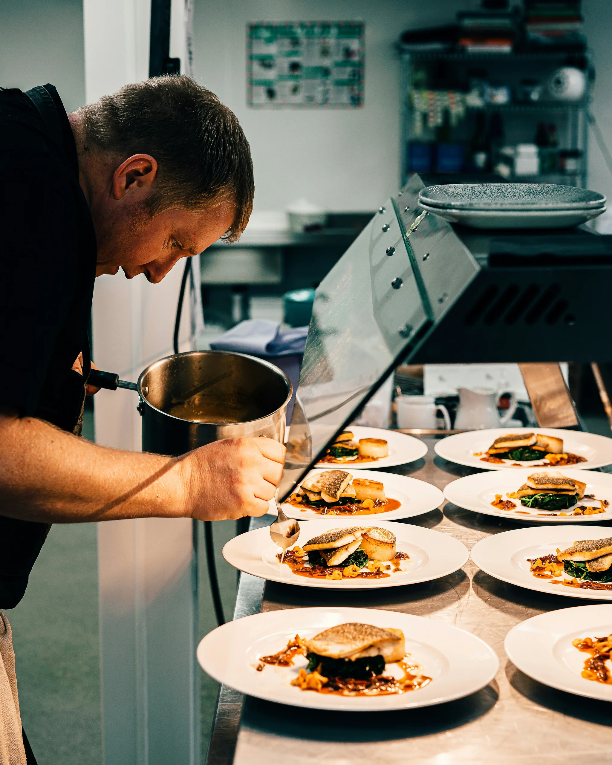 Working with Elior image chef preparing dishes