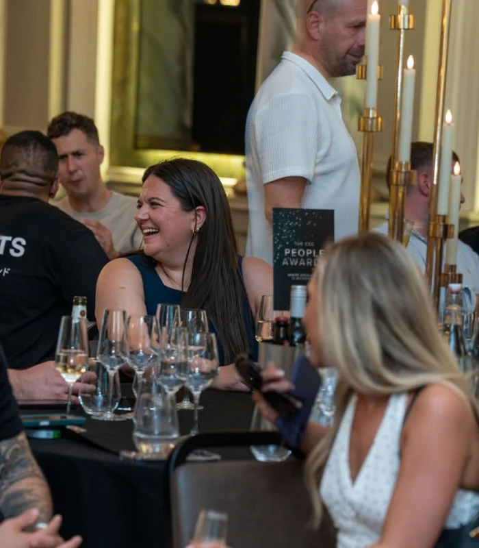Mining director: brunette woman smiling at a recruitment awards ceremony
