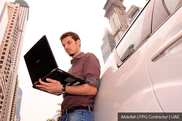 A contractor using a laptop