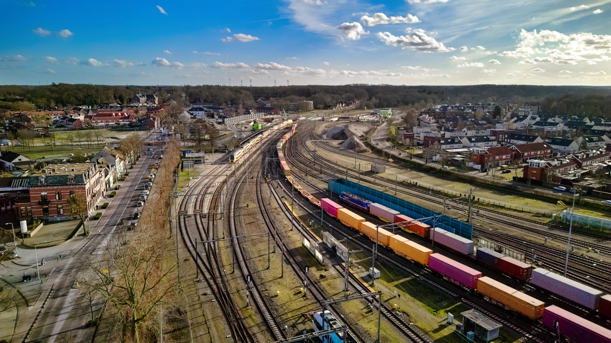 Railroad, train tracks and trains aerial drone view from above, railway station in the Netherlands, transportation, logistics and public transport infrastructure concept