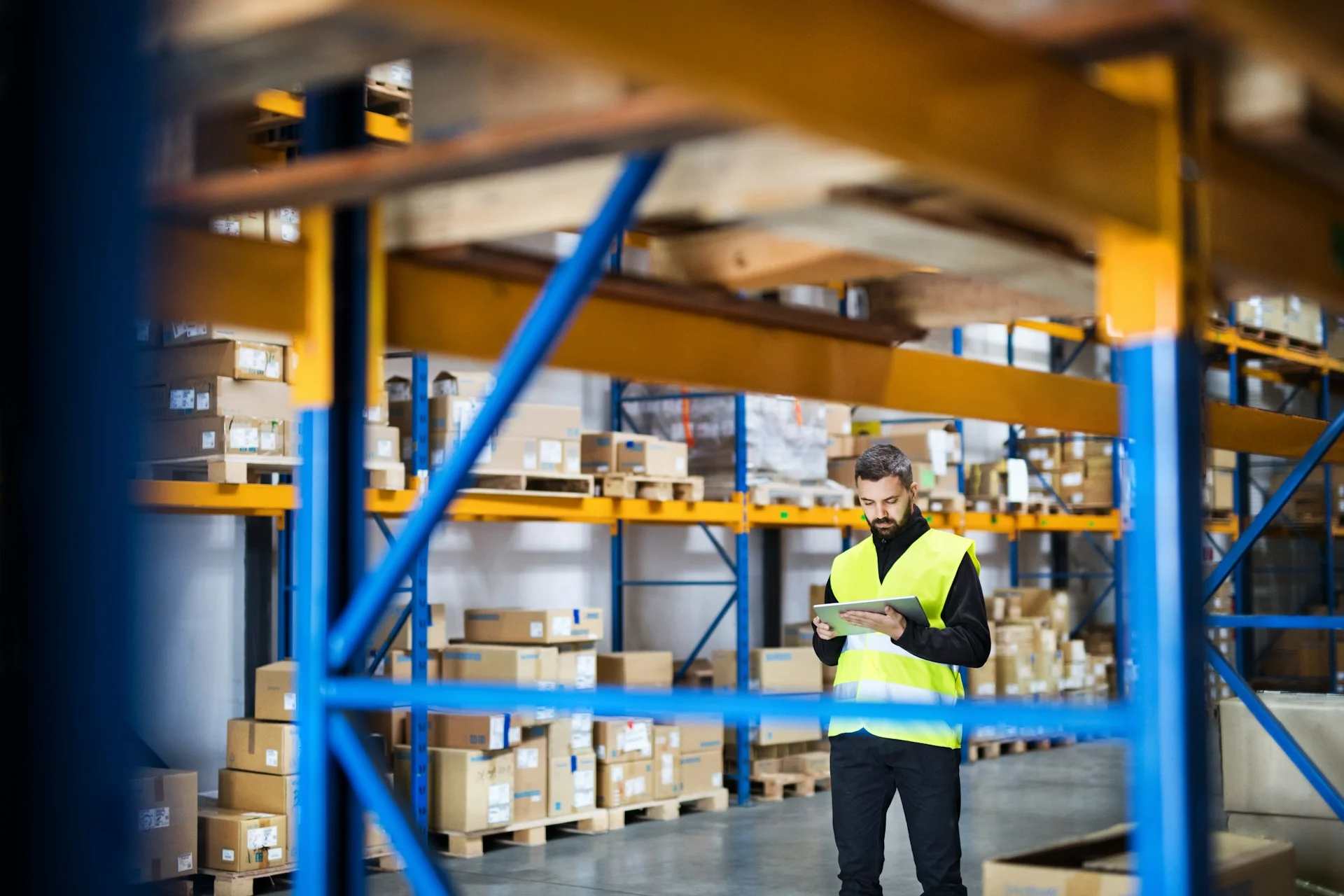 portrait-of-a-young-male-warehouse-worker-with-tablet-