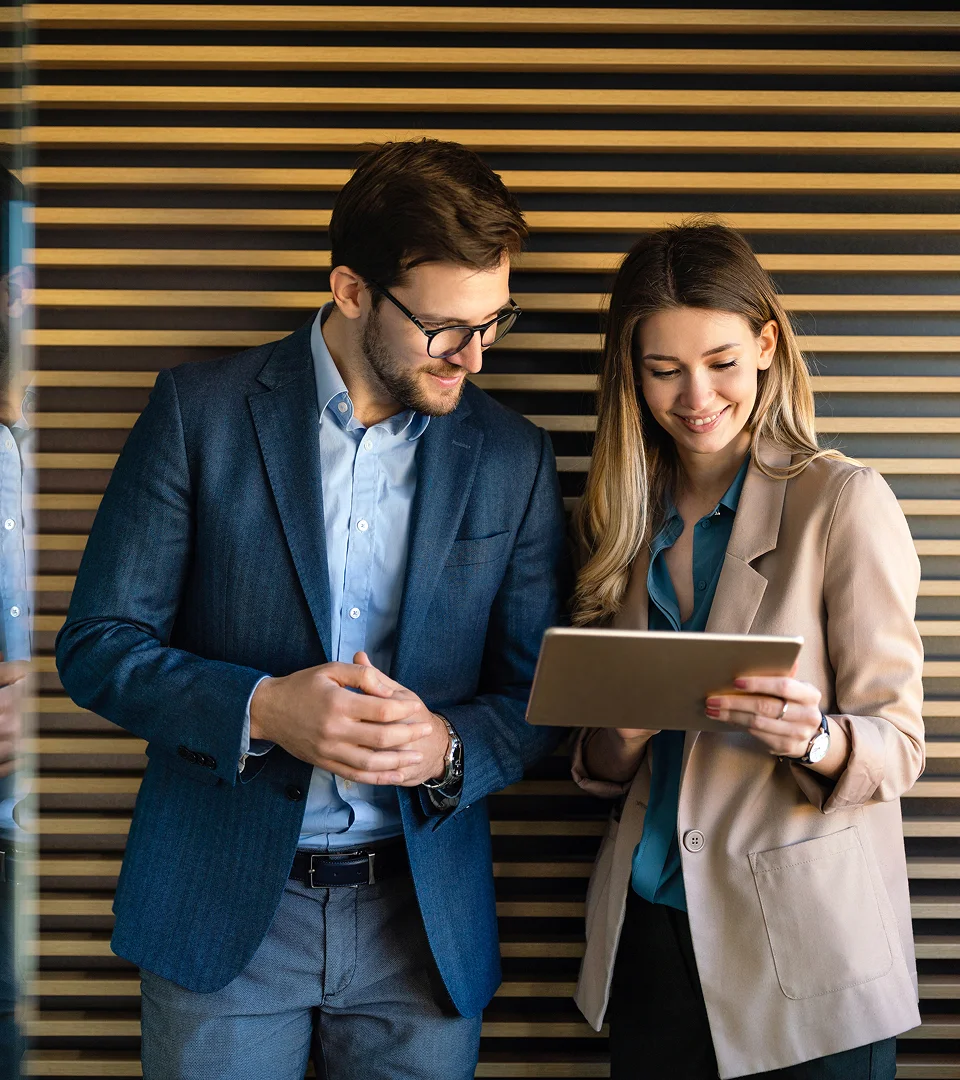 two people looking at tablet