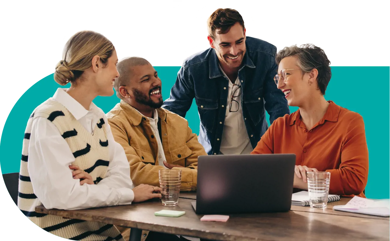 colleagues laughing in a meeting