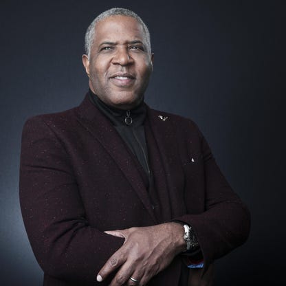 A portrait of Robert F Smith, a successful black American entrepreneur.