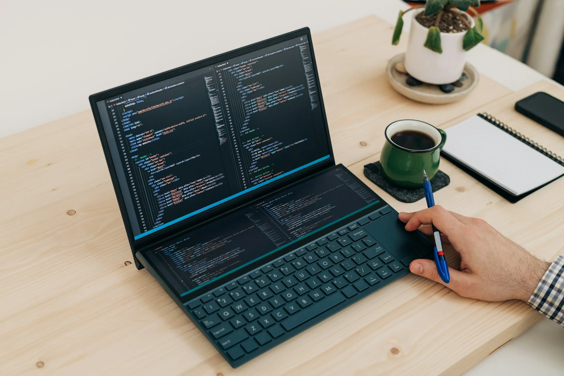 a-person-is-writing-on-a-laptop-on-a-desk-