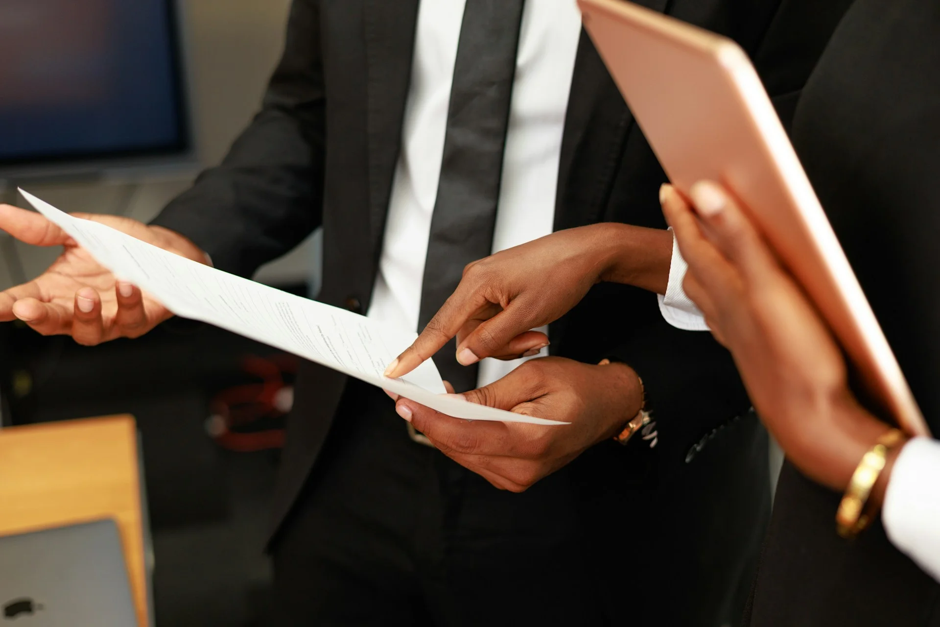 business hand pointing at paper