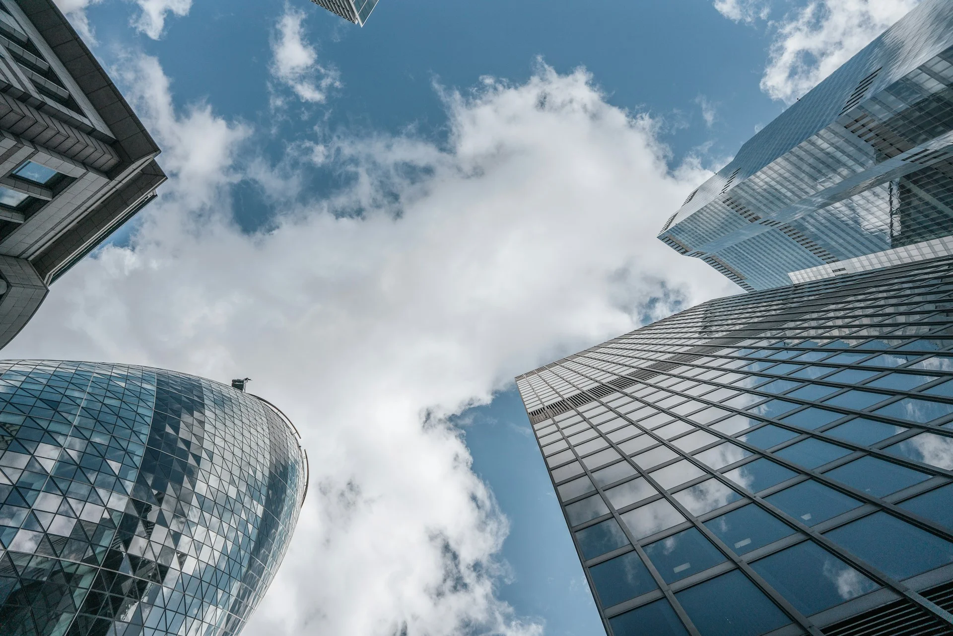 a-group-of-tall-buildings-standing-next-to-each-other-