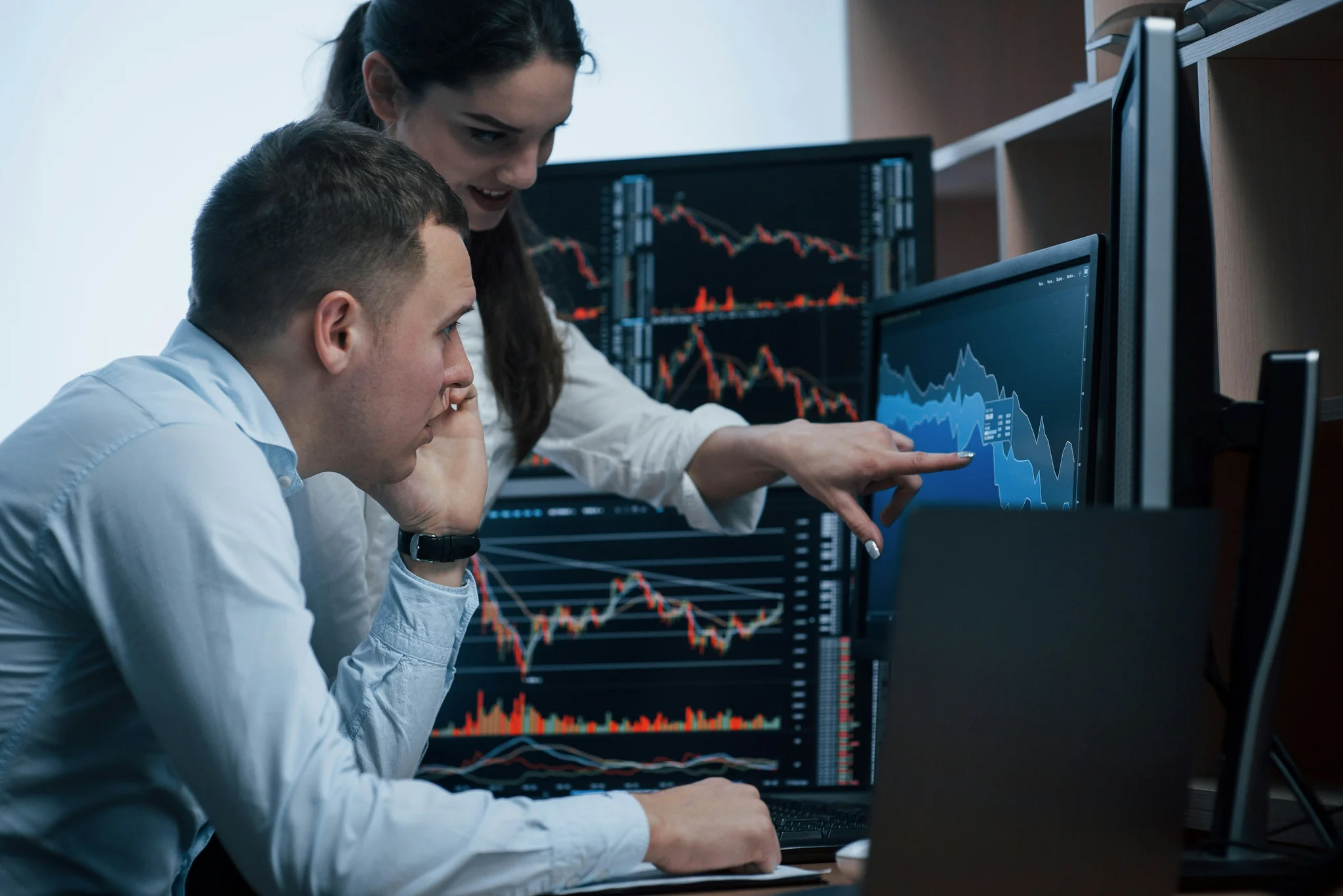 Teamwork, statistics and business people on tablet in office for stock trading, research and finance.