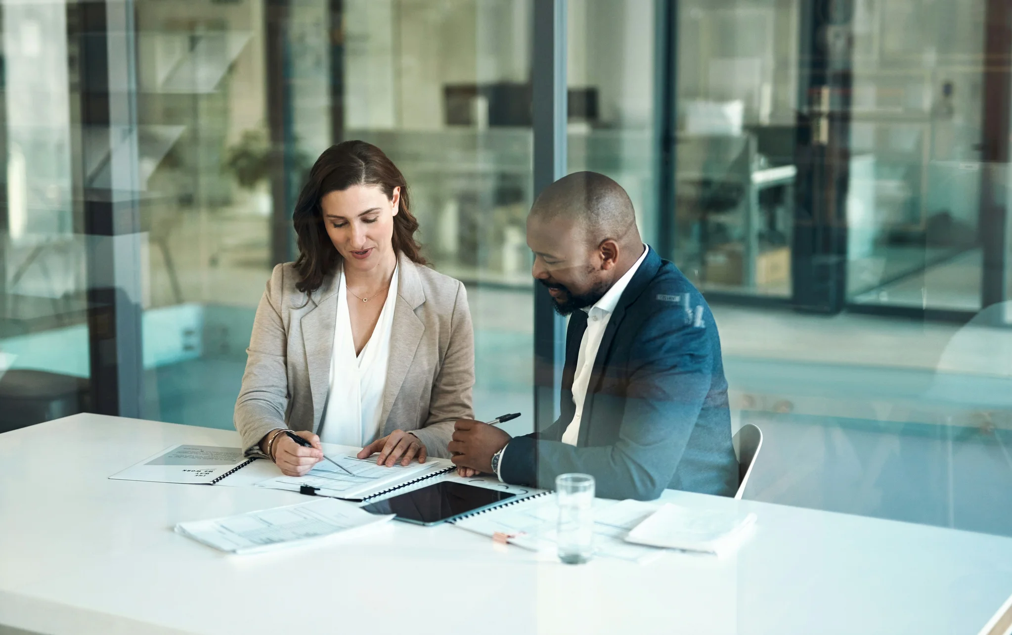 office-meeting-and-documents-of-business-people-clients-or-team-for-taxes-audit-or-revenue-report-in-accounting-paperwork-review-and-advice-of-woman-financial-advisor-or-accountant-support-