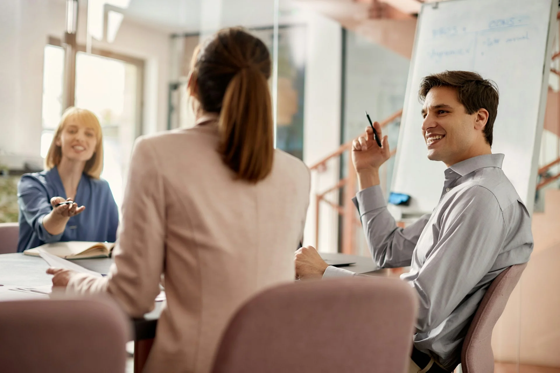 business people in meeting smiling