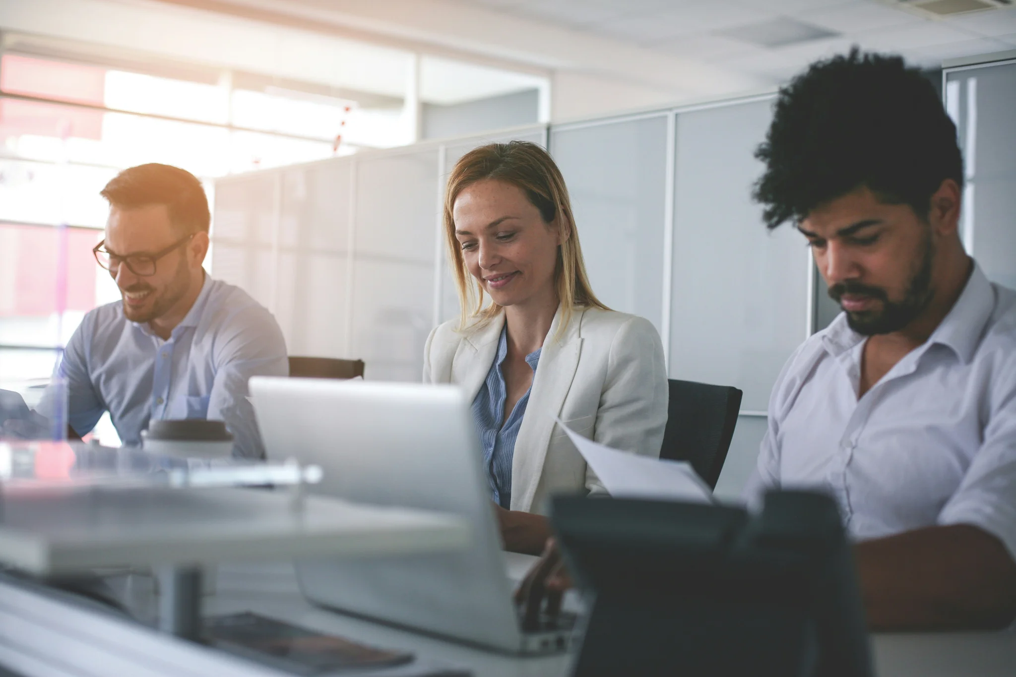 business-people-working-in-office-business-people-having-coffee-break-african-man-holding-document-and-using-laptop-